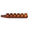 Set of vintage egg cups on teak holder