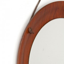 Round small model vintage Danish mirror on leather cord