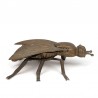 Vintage brass object in the shape of a fly