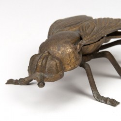 Vintage brass object in the shape of a fly